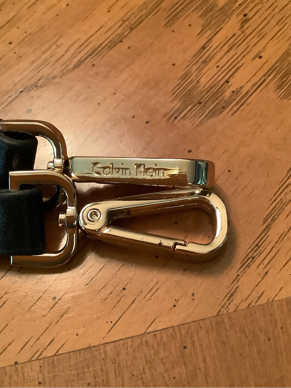 Calvin Klein Gold and Black Purse Strap with goldstone clips.